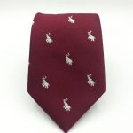Custom neckties woven in a solid color with recurring logo of a elephant, personalized neckties