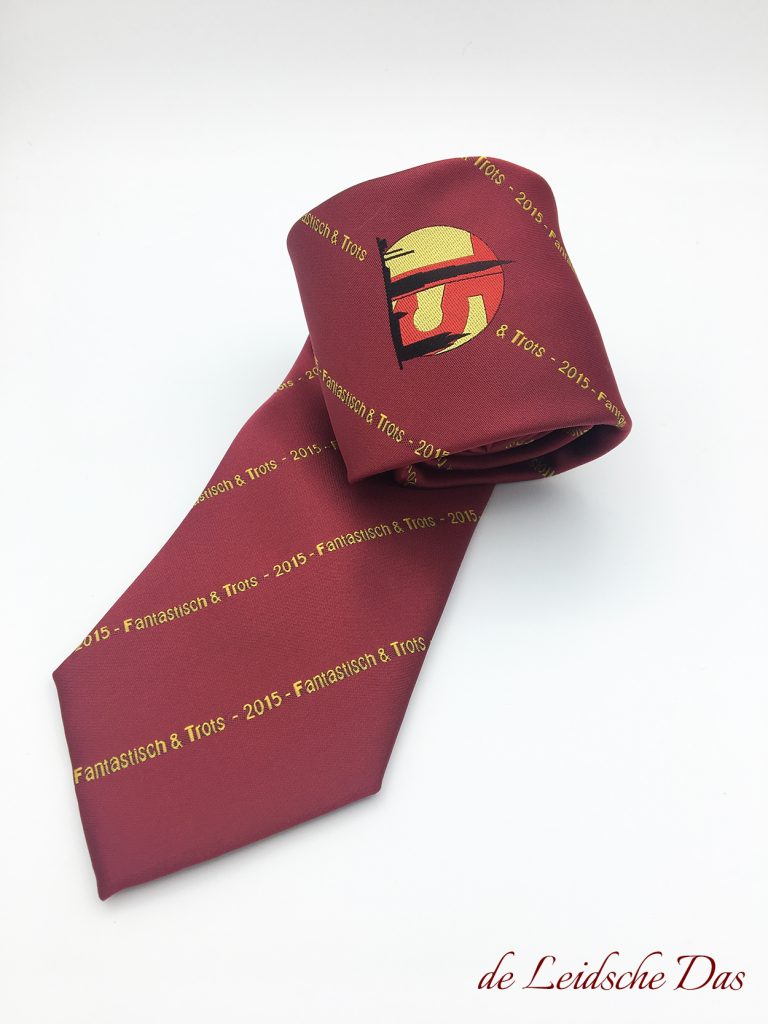 Woven ties in your club style, ties in your club colors and with the crest of the club plus repeating text