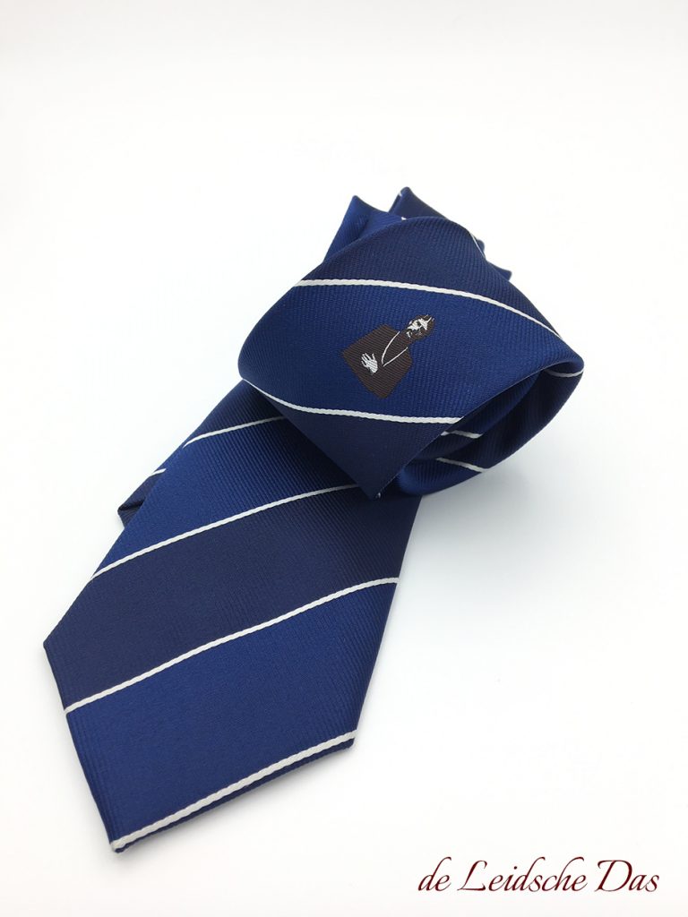 Made to order striped microfiber neckties in blue shades with white lines and a centered emblem