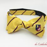 Pre-tied yellow custom bowties with lines repp woven with a interwoven crest