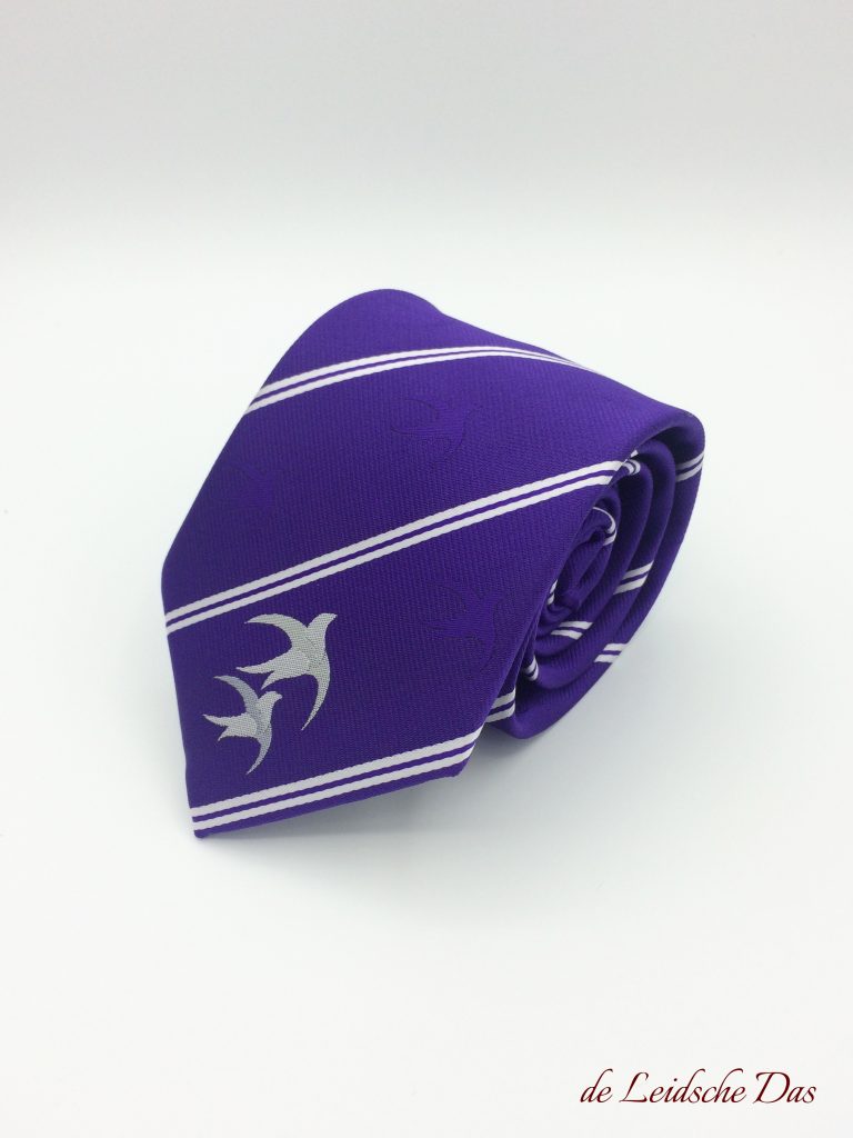 Purple bespoke neckties with a logo placed at the necktie tip and purple and white lines custom woven in high-quality microfiber